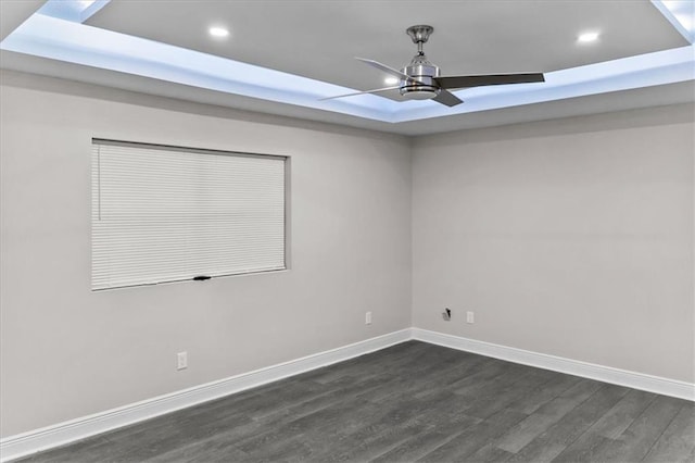 empty room with ceiling fan, dark wood-style flooring, baseboards, and recessed lighting