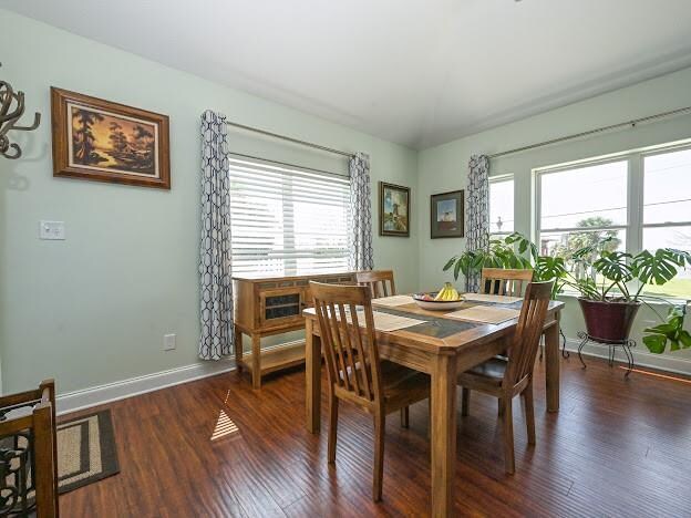 dining space featuring dark hardwood / wood-style flooring