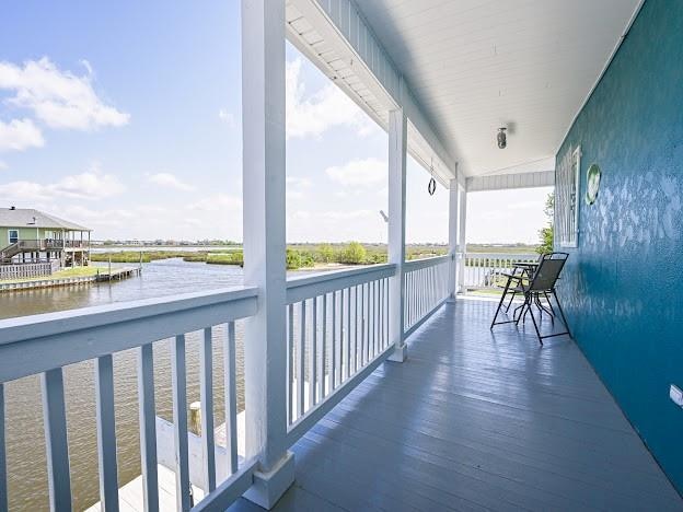 balcony featuring a water view