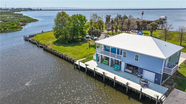 drone / aerial view featuring a water view