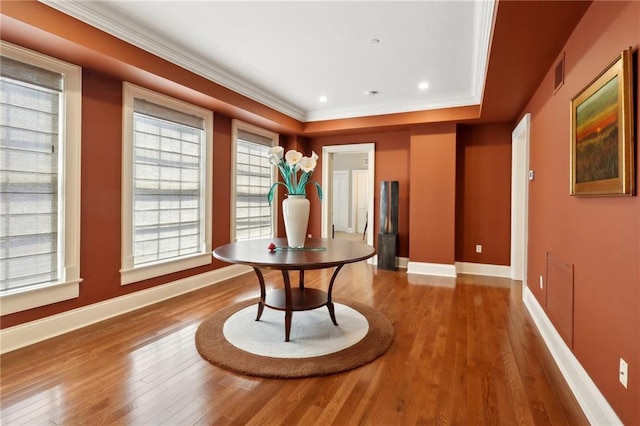 416 Common St Unit 6, New Orleans, LA 70130 - dining area featuring baseboards, wood finished floors, and crown molding