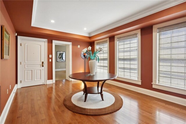 416 Common St Unit 6, New Orleans, LA 70130 - foyer with baseboards, wood-type flooring, ornamental molding, and recessed lighting