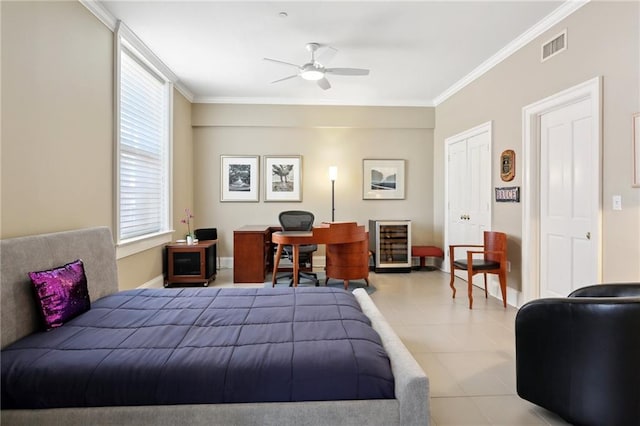 bedroom with ceiling fan and crown molding