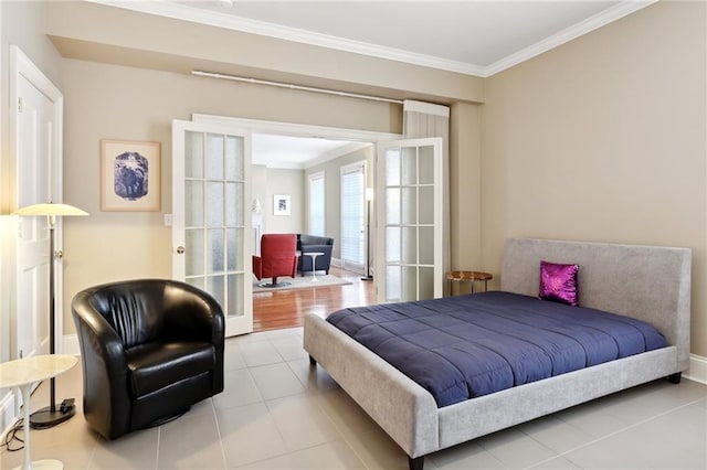 bedroom with ornamental molding and light wood-type flooring