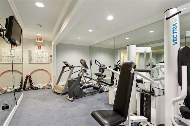 exercise room with carpet floors and crown molding