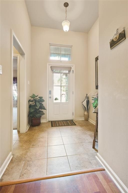 entrance foyer with light tile patterned flooring