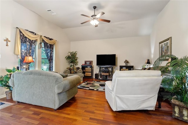 living room featuring ceiling fan, hardwood / wood-style flooring, and lofted ceiling