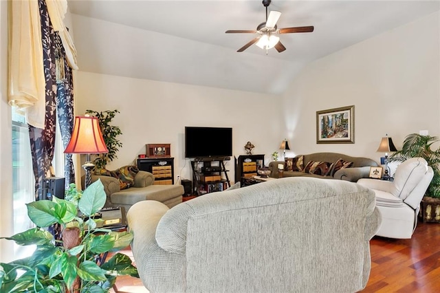 living room with vaulted ceiling, ceiling fan, and dark hardwood / wood-style floors