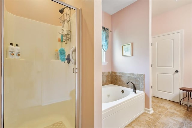 bathroom with separate shower and tub