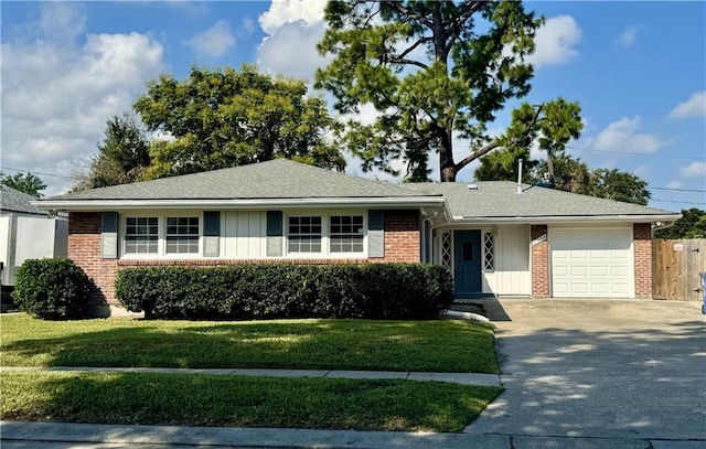 ranch-style home featuring a front yard and a garage