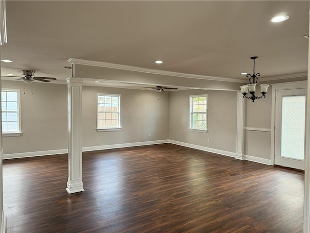 interior space featuring ceiling fan with notable chandelier, plenty of natural light, and dark wood-type flooring