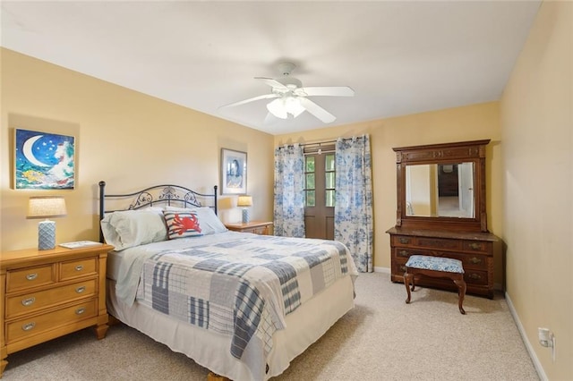 bedroom featuring ceiling fan and light colored carpet