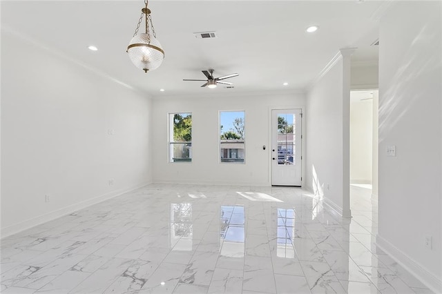 unfurnished room with a wealth of natural light, ceiling fan, and crown molding