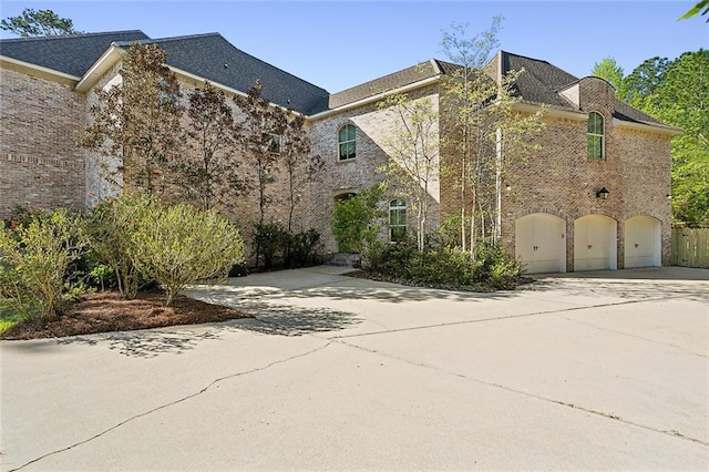 view of side of property with a garage