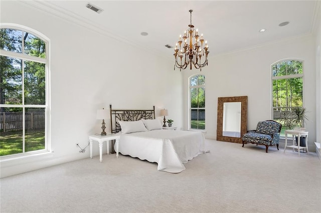 carpeted bedroom with an inviting chandelier and crown molding