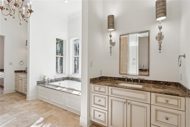 bathroom with vanity, a bathtub, and crown molding