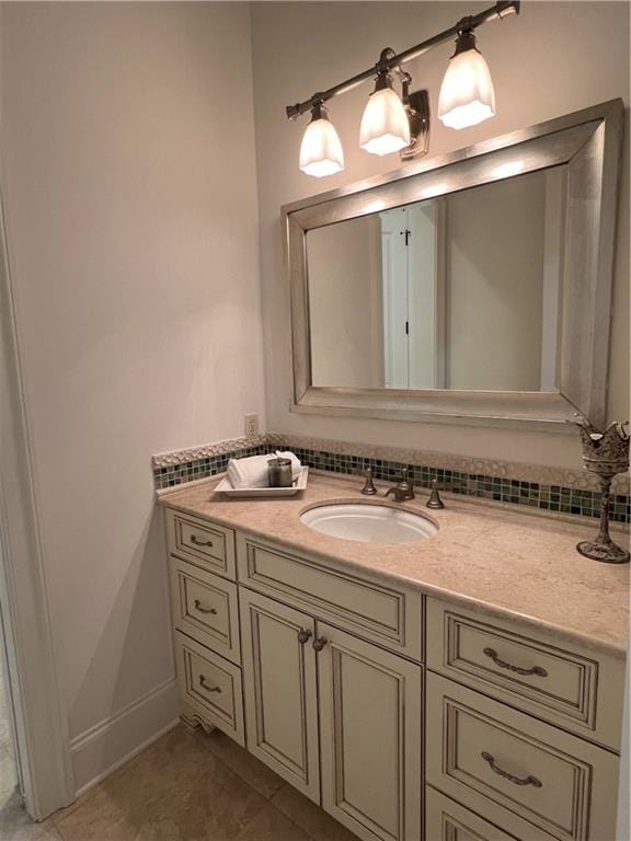 bathroom featuring tile patterned flooring and vanity