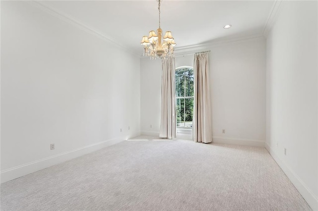 carpeted empty room with crown molding and an inviting chandelier