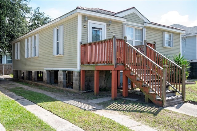 view of front facade with a wooden deck