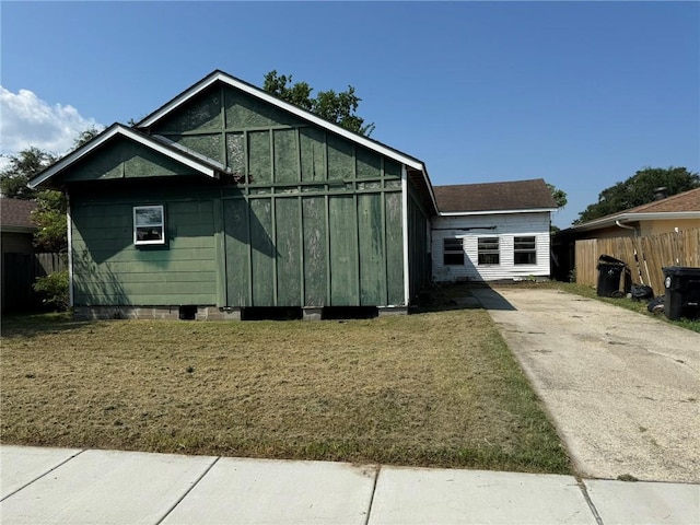 view of property exterior featuring a lawn