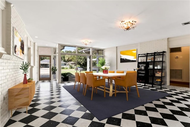 dining room with brick wall