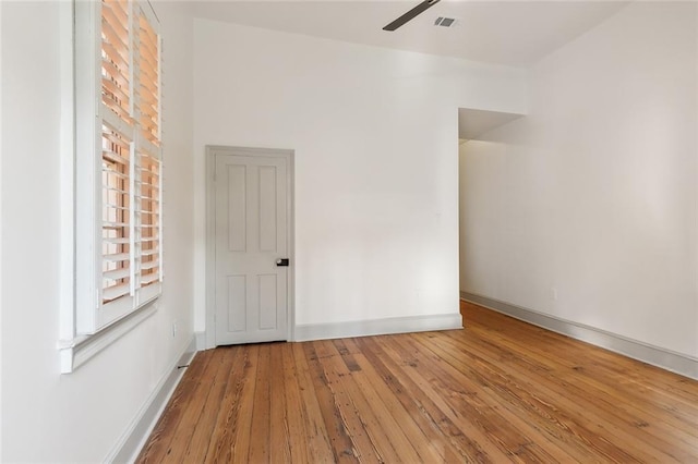 spare room featuring ceiling fan and light hardwood / wood-style flooring