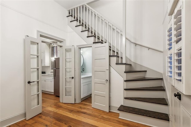 staircase featuring hardwood / wood-style floors