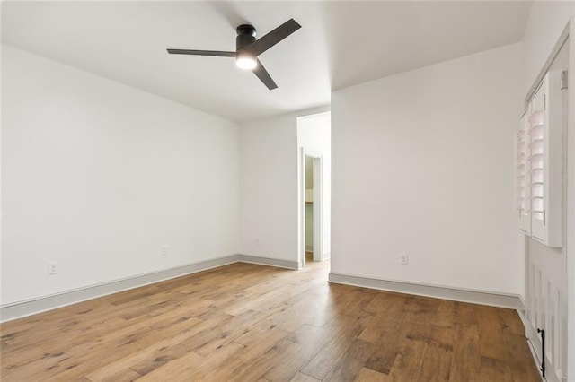 unfurnished room with ceiling fan and light hardwood / wood-style flooring