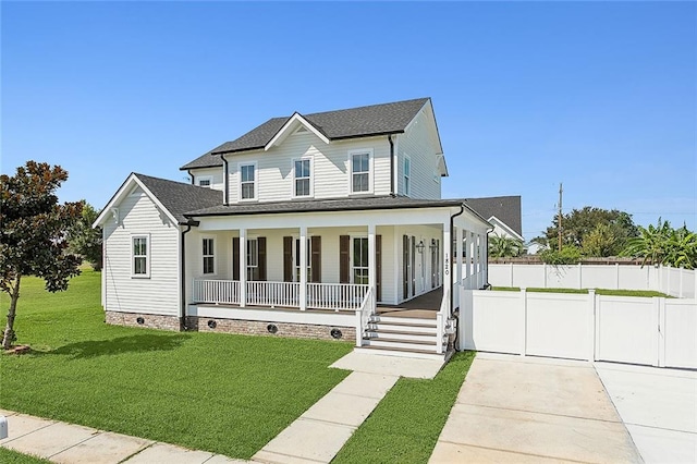 view of front facade with a front lawn and a porch