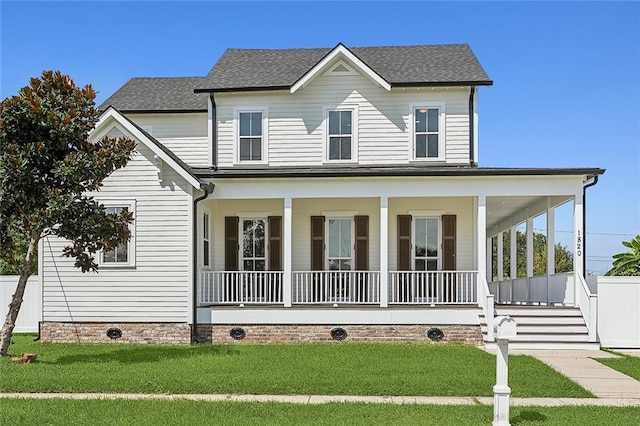 view of front facade with a porch and a front lawn