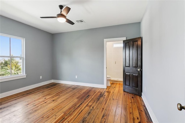 empty room featuring light wood-type flooring and ceiling fan