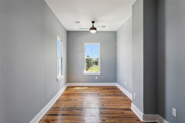 empty room featuring wood-type flooring and ceiling fan