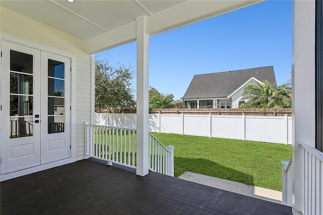 unfurnished sunroom featuring plenty of natural light and french doors