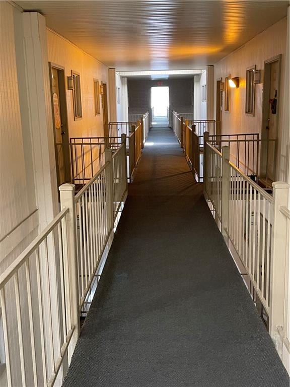 hallway with dark carpet