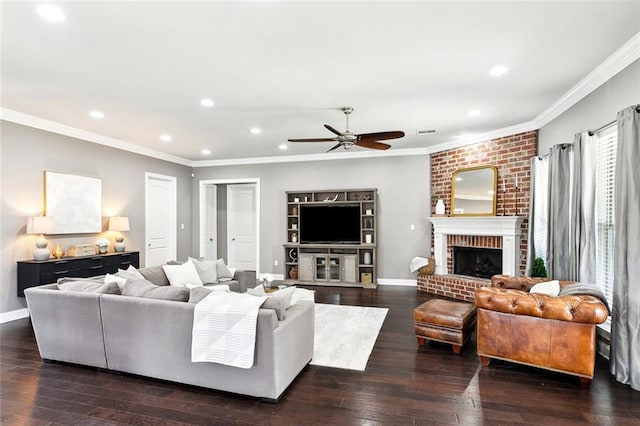 living room with ceiling fan, a fireplace, crown molding, and dark hardwood / wood-style flooring