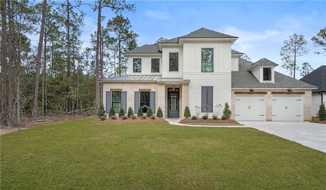 view of front of home with a garage and a front lawn