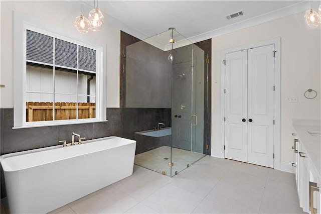 bathroom featuring vanity, plus walk in shower, and tile patterned floors