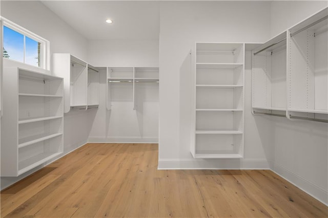 walk in closet featuring light hardwood / wood-style floors