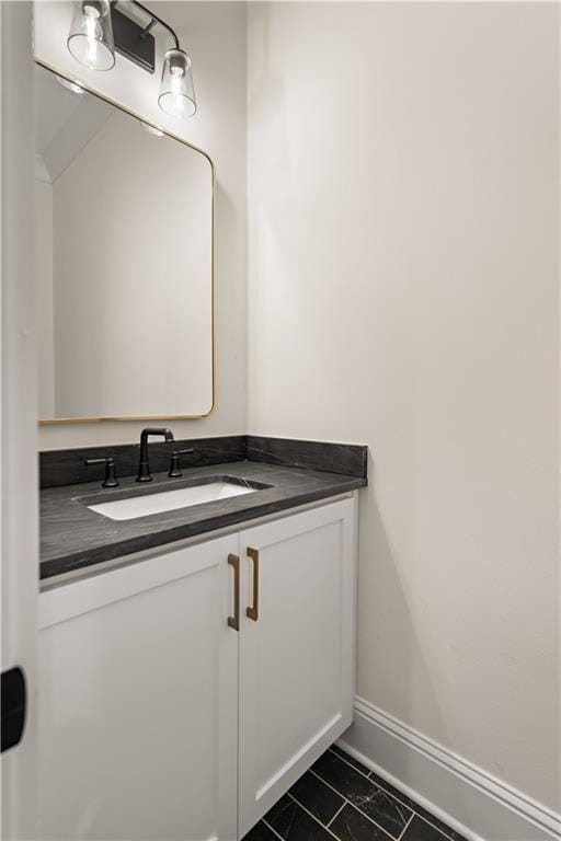 bathroom featuring tile patterned flooring and vanity