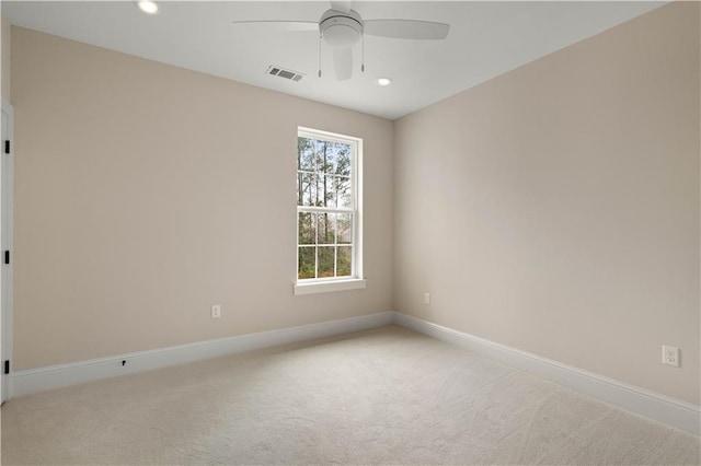 carpeted empty room with ceiling fan