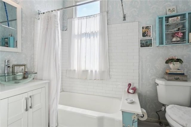 full bathroom featuring shower / bath combination with curtain, vanity, and toilet