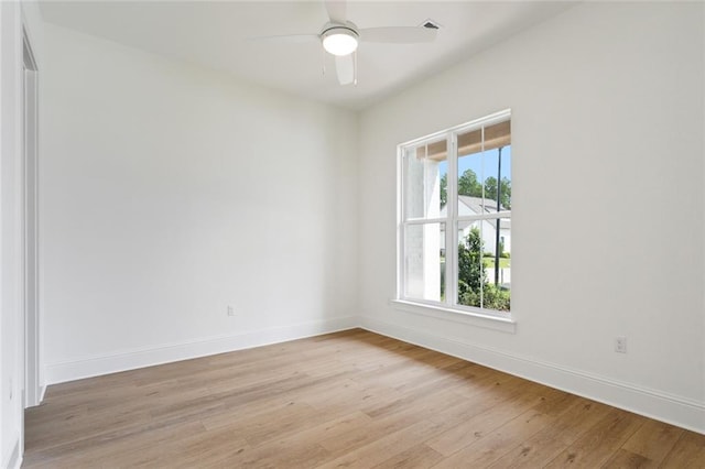 unfurnished room featuring light wood-type flooring and ceiling fan