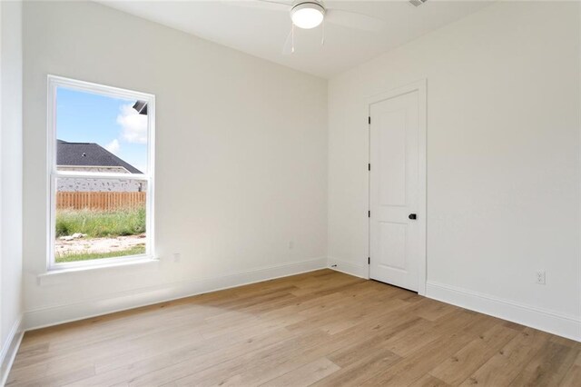 unfurnished room featuring ceiling fan and light hardwood / wood-style floors