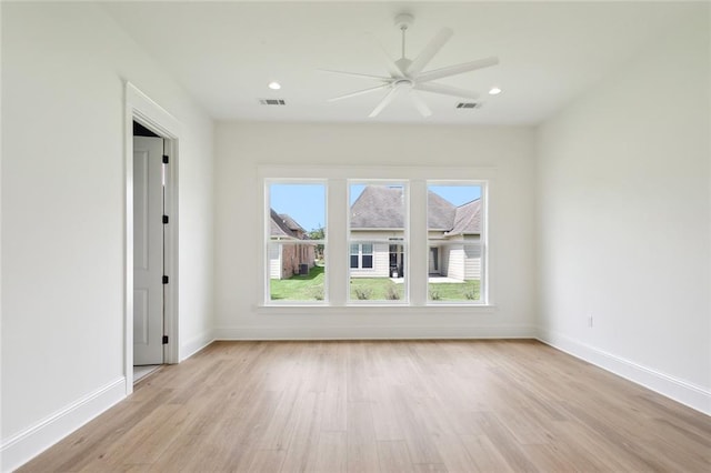 unfurnished room featuring ceiling fan and light wood-type flooring