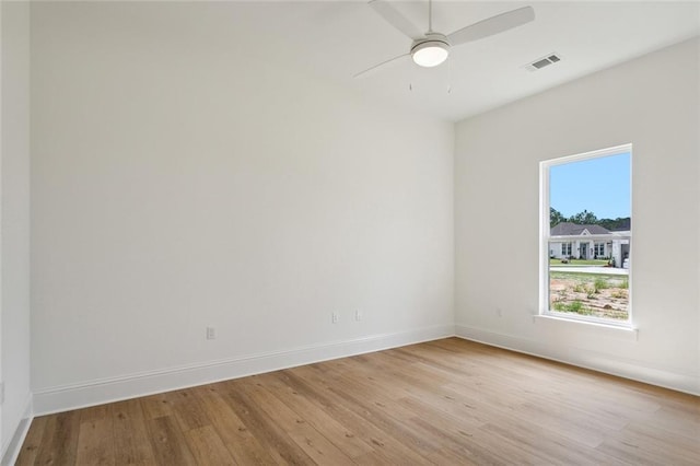 unfurnished room featuring ceiling fan and light hardwood / wood-style flooring