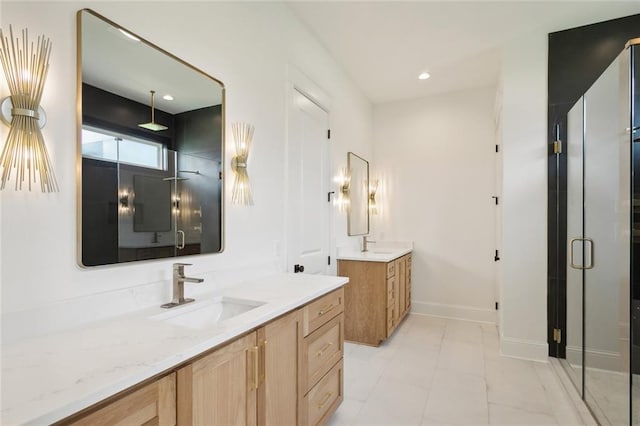 bathroom featuring an enclosed shower and vanity