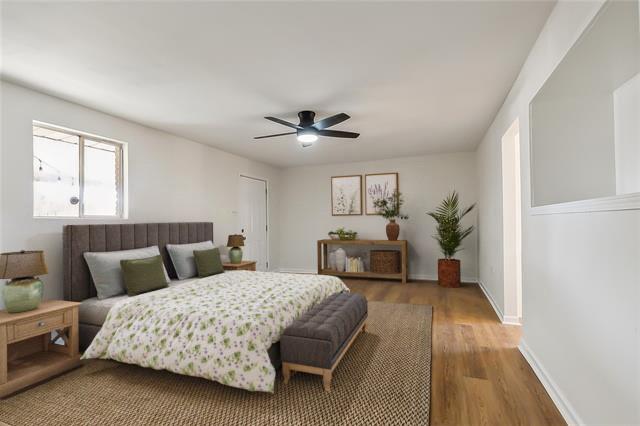 bedroom featuring hardwood / wood-style floors and ceiling fan