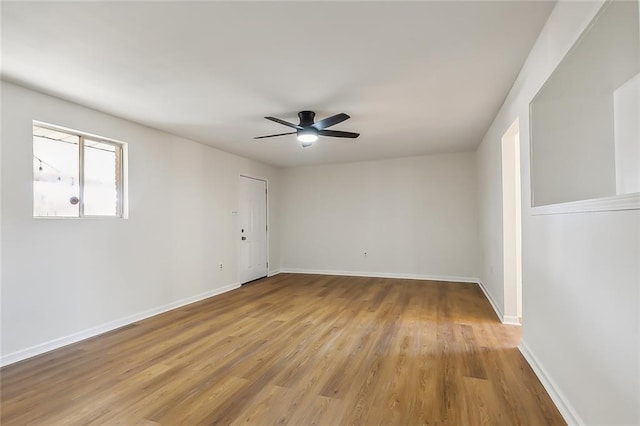 spare room featuring ceiling fan and light wood-type flooring