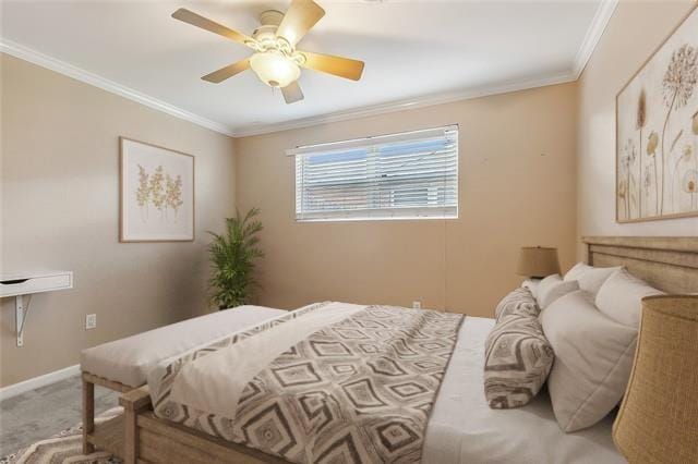 bedroom featuring crown molding, ceiling fan, and carpet