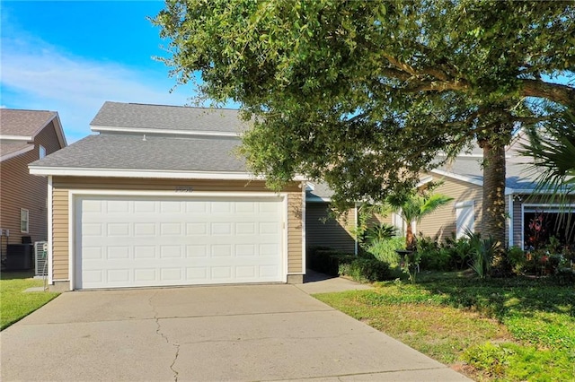 view of front facade with central AC unit and a garage